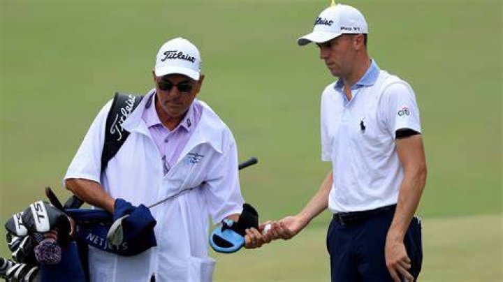 What does Justin Thomas's father do for a living?